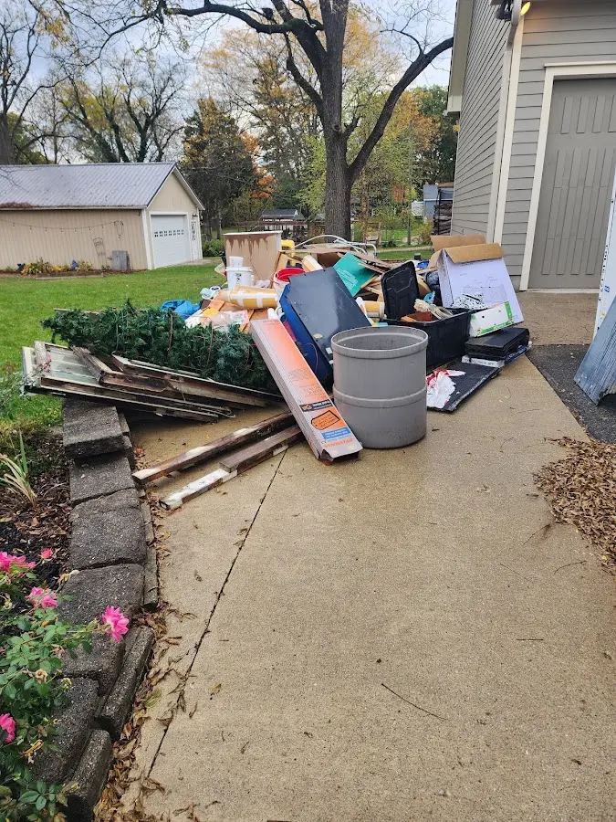 Dumpster being loaded with debris for Estate Cleanout Dumpster Rental in Bremen